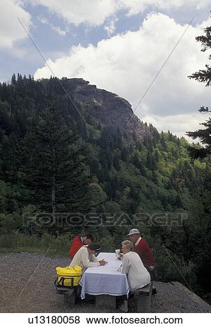 Stock Photo -  picnic, Blue Ridge Parkway, NC, North Carolina, People picnicking along the Blue Ridge Parkway with a view of Devil's Courthouse in North Carolina.. Fotosearch
