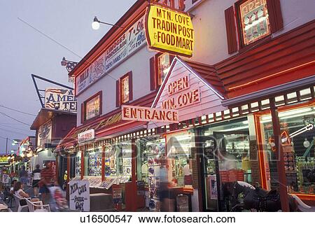 Stock Photo -  Pigeon Forge, TN, Tennessee, Gift shop illuminated with neon lights in Pigeon Forge at night.. Fotosearch