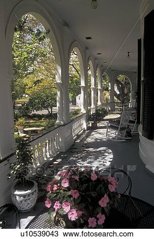 porch, country inn, Charleston, South Carolina, SC, The front porch at Two Meeting Street Inn in downtown Charleston in the spring. View Large Photo Image Stock Image - porch, country inn, Charleston, South Carolina, SC, The front porch at Two Meeting Street Inn in downtown Charleston in the spring.. Fotosearch