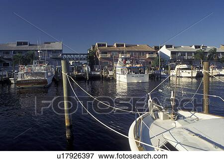 Stock Photo -  Punta Gorda, FL, Gulf of Mexico, Florida, City Dock and Fisherman's Village Marina along the banks of Peace River in Punta Gorda.. Fotosearch