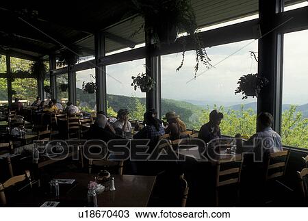 restaurant, NC, Blue Ridge Parkway, Pisgah National Forest, North Carolina, People eating at the restaurant at Pisgah Lodge with scenic view of the mountains in the background in North Carolina. View Large Photo Image Stock Image - restaurant, NC, Blue Ridge Parkway, Pisgah National Forest, North Carolina, People eating at the restaurant at Pisgah Lodge with scenic view of the mountains in the background in North Carolina.. Fotosearch