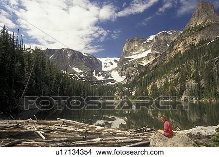 Rocky Mountain National Park, CO, Colorado, Woman sitting on a boulder at Odessa Lake in Rocky Mountain Nat'l Park. View Large Photo Image Picture - Rocky Mountain National Park, CO, Colorado, Woman sitting on a boulder at Odessa Lake in Rocky Mountain Nat'l Park.. Fotosearch