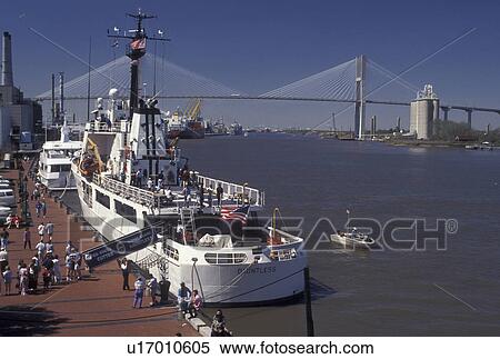 Savannah, GA, Coast Guard, Georgia, People touring the Duntless, U. S. Coast Guard Boat, docked along the Historic River Front along the Savannah River in Savannah. Talmadge Memorial Bridge crossing the Savannah River in the distance. View Large Photo Image Stock Photography - Savannah, GA, Coast Guard, Georgia, People touring the Duntless, U. S. Coast Guard Boat, docked along the Historic River Front along the Savannah River in Savannah. Talmadge Memorial Bridge crossing the Savannah River in the distance.. Fotosearch