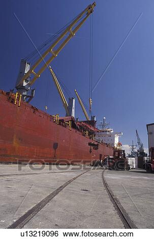 Savannah, GA, Georgia, Loading cargo onto a cargo ship moored at the Dock Yard on the Savannah River in Savannah. View Large Photo Image Stock Photograph - Savannah, GA, Georgia, Loading cargo onto a cargo ship moored at the Dock Yard on the Savannah River in Savannah. . Fotosearch