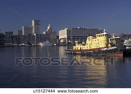 Savannah, tugboat, GA, Georgia, Tugboats on the Savannah River with view of downtown Savannah. View Large Photo Image Picture - Savannah, tugboat, GA, Georgia, Tugboats on the Savannah River with view of downtown Savannah.. Fotosearch