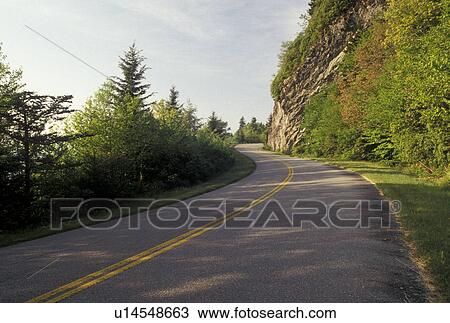 Stock Image -  scenic road, NC, Blue Ridge Parkway, North Carolina, The Blue Ridge Parkway is a scenic drive through the mountains in North Carolina.. Fotosearch