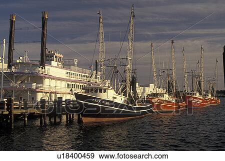 Stock Photo -  shrimp boat, riverboat, Mississippi, MS, Biloxi, Shrimp boats and riverboat docked in the harbor of the Gulf of Mexico in Biloxi.. Fotosearch