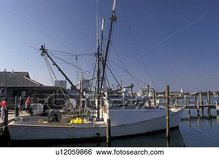Stock Photograph -  shrimp boats, Outer Banks, North Carolina, Ocracoke, NC, Shrimp boats docked in the harbor in Ocracoke on Cape Hatteras National Seashore on the Outer Banks.. Fotosearch
