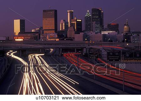 skyline, Atlanta, GA, Georgia, Traffic lights streak on I-75/I-85 at sunset and view of the skyline of downtown Atlanta. View Large Photo Image Stock Image - skyline, Atlanta, GA, Georgia, Traffic lights streak on I-75/I-85 at sunset and view of the skyline of downtown Atlanta.. Fotosearch