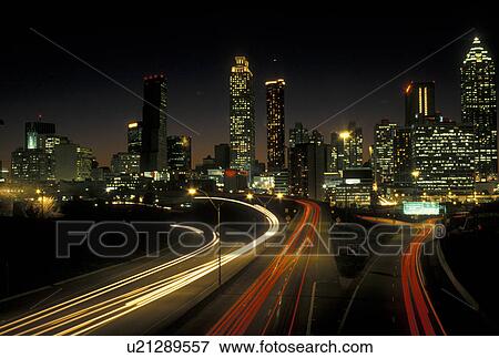 skyline, Atlanta, GA, Georgia, Traffic lights streak on Freedom Parkway in the evening and skyline of downtown Atlanta. View Large Photo Image Stock Photo - skyline, Atlanta, GA, Georgia, Traffic lights streak on Freedom Parkway in the evening and skyline of downtown Atlanta.. Fotosearch