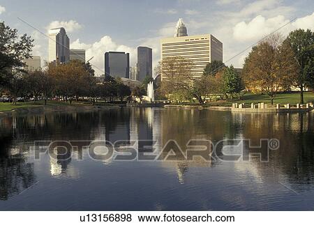 skyline, Charlotte, NC, North Carolina, Downtown skyline of Charlotte reflecting in a pond at Marshall Park. View Large Photo Image Stock Photo - skyline, Charlotte, NC, North Carolina, Downtown skyline of Charlotte reflecting in a pond at Marshall Park.. Fotosearch
