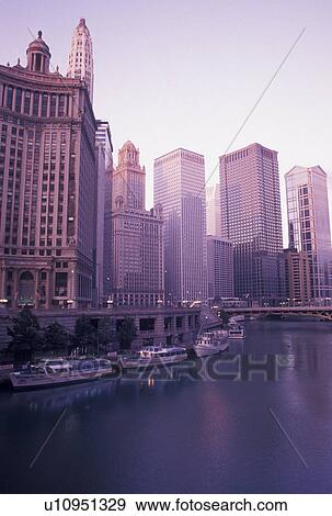 Stock Photo -  skyline, Chicago, IL, Chicago River, Illinois, Downtown skyline of Chicago along the Chicago River at sunrise.. Fotosearch