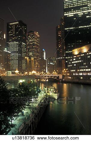 skyline, Chicago, IL, Chicago River, Illinois, Downtown skyline of Chicago is illuminated at night along the Chicago River. View Large Photo Image Stock Photograph - skyline, Chicago, IL, Chicago River, Illinois, Downtown skyline of Chicago is illuminated at night along the Chicago River.. Fotosearch