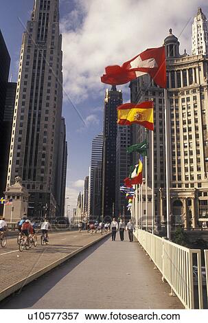 Stock Photo -  skyline, Chicago, IL, Illinois, Bikers on Michigan Avenue Bridge in downtown Chicago.. Fotosearch