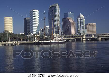 Stock Image -  skyline, Tampa, FL, Florida, Tampa Bay, View of tall ship docked on Hillsborough Bay and the skyline of downtown Tampa.. Fotosearch