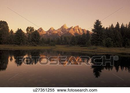 Snake River, Grand Teton National Park, Jackson Hole, WY, Wyoming, Scenic view of the Grand Teton Mountains reflecting in the calm waters of the Snake River at sunrise in Grand Teton Nat'l Park in Wyoming. View Large Photo Image Stock Photography - Snake River, Grand Teton National Park, Jackson Hole, WY, Wyoming, Scenic view of the Grand Teton Mountains reflecting in the calm waters of the Snake River at sunrise in Grand Teton Nat'l Park in Wyoming.. Fotosearch