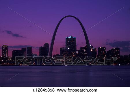 St. Louis, Gateway Arch, MO, Missouri, View of the Gateway Arch and downtown skyline of Saint Louis along the Mississippi River at sunset. View Large Photo Image Stock Photo - St. Louis, Gateway Arch, MO, Missouri, View of the Gateway Arch and downtown skyline of Saint Louis along the Mississippi River at sunset. . Fotosearch