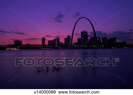 St. Louis, Gateway Arch, MO, Missouri, View of the Gateway Arch and downtown skyline of Saint Louis along the Mississippi River at sunset. View Large Photo Image Stock Photo - St. Louis, Gateway Arch, MO, Missouri, View of the Gateway Arch and downtown skyline of Saint Louis along the Mississippi River at sunset. . Fotosearch
