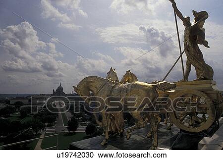 St. Paul, State Capitol, MN, State House, Minnesota, Twin Cities, The Progress of the State gold chariot statue under the dome of the Minnesota State Capitol building in the capital city of Saint Paul. The St. Peter's Cathedral can be seen in the distanc View Large Photo Image Stock Image - St. Paul, State Capitol, MN, State House, Minnesota, Twin Cities, The Progress of the State gold chariot statue under the dome of the Minnesota State Capitol building in the capital city of Saint Paul. The St. Peter's Cathedral can be seen in the distanc. Fotosearch