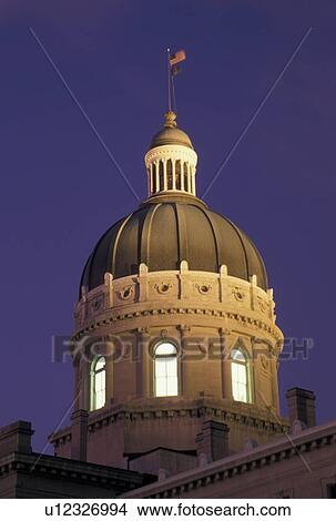State Capitol, Indianapolis, IN, State House, Indiana, The dome of the State Capitol Building is illuminated in the evening in the capital city of Indianapolis. View Large Photo Image Picture -  State Capitol, Indianapolis, IN, State House, Indiana, The dome of the State Capitol Building is illuminated in the evening in the capital city of Indianapolis.. Fotosearch