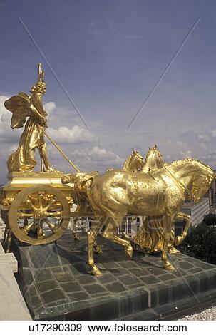 Stock Photo -  State Capitol, St. Paul, MN, State House, Minnesota, Twin Cities, The Progress of the State gold chariot statue representing prosperity under the dome of the Minnesota State Capitol building in the capital city of Saint Paul.. Fotosearch