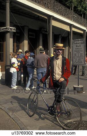 street artist, New Orleans, French Quarter, Louisiana, LA, Man wearing a straw hat with a bike in the French Quarter of New Orleans. View Large Photo Image Stock Image - street artist, New Orleans, French Quarter, Louisiana, LA, Man wearing a straw hat with a bike in the French Quarter of New Orleans. . Fotosearch