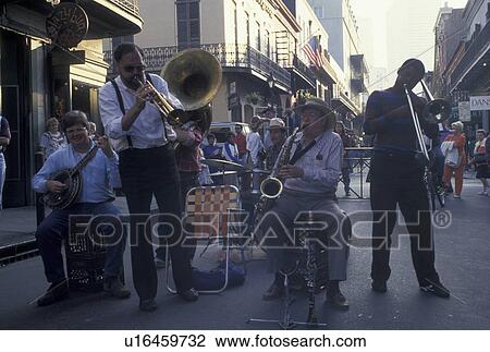street musicians, New Orleans, jazz, LA, French Quarter, Louisiana, Street musicians entertain a crowd of people along the street in the French Quarter in New Orleans. View Large Photo Image Stock Image - street musicians, New Orleans, jazz, LA, French Quarter, Louisiana, Street musicians entertain a crowd of people along the street in the French Quarter in New Orleans. . Fotosearch