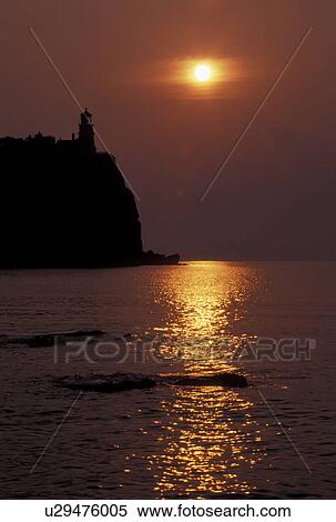 sunrise, lighthouse, Lake Superior, North Shore Drive, Two Harbors, MN, Minnesota, The sun rises behind Split Rock Lighthouse which is situated on a high cliff on the north shore of Lake Superior at Split Rock Lighthouse State Park in Two Harbors. View Large Photo Image Stock Photography - sunrise, lighthouse, Lake Superior, North Shore Drive, Two Harbors, MN, Minnesota, The sun rises behind Split Rock Lighthouse which is situated on a high cliff on the north shore of Lake Superior at Split Rock Lighthouse State Park in Two Harbors.. Fotosearch