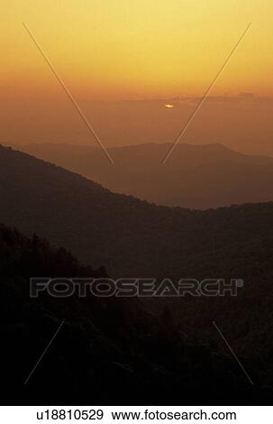 Stock Photo -  sunrise, mountains, NC, Blue Ridge Parkway, Pisgah National Forest, North Carolina, Scenic view of the mountains at sunrise from the Blue Ridge Pkwy. in North Carolina.. Fotosearch