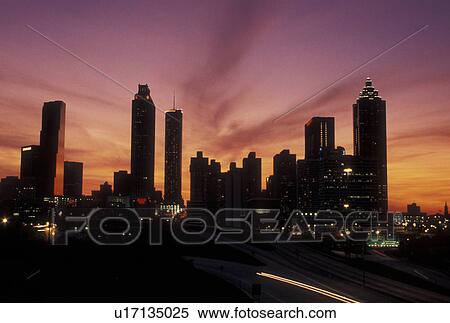 sunset, Atlanta, GA, skyline, Georgia, Traffic lights streak on Freedom Parkway at sunset and view of the skyline of downtown Atlanta. View Large Photo Image Stock Photography - sunset, Atlanta, GA, skyline, Georgia, Traffic lights streak on Freedom Parkway at sunset and view of the skyline of downtown Atlanta.. Fotosearch