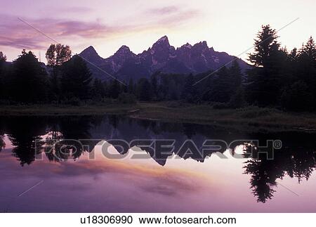 sunset, Grand Teton National Park, Snake River, Jackson Hole, WY, Wyoming, Scenic view of the Grand Teton Mountains reflecting in the calm waters of the Snake River at sunset in Grand Teton Nat'l Park in Wyoming. View Large Photo Image Stock Image - sunset, Grand Teton National Park, Snake River, Jackson Hole, WY, Wyoming, Scenic view of the Grand Teton Mountains reflecting in the calm waters of the Snake River at sunset in Grand Teton Nat'l Park in Wyoming.. Fotosearch
