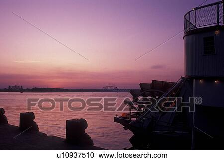 sunset, Louisville, KY, riverboat, Kentucky, Ohio River, Silhouette of the paddle wheel on the Belle of Louisville Riverboat docked along the Ohio River at sunset. View Large Photo Image Stock Image - sunset, Louisville, KY, riverboat, Kentucky, Ohio River, Silhouette of the paddle wheel on the Belle of Louisville Riverboat docked along the Ohio River at sunset. . Fotosearch