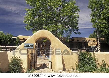 Taos, NM, New Mexico, Adobe style gate at the entrance ot an antique shop in Taos. View Large Photo Image Picture - Taos, NM, New Mexico, Adobe style gate at the entrance ot an antique shop in Taos.. Fotosearch