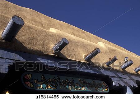 Stock Photography -  Taos, NM, New Mexico, Adobe style architecture shop in the village of Taos.. Fotosearch