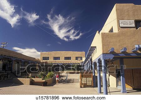 Taos, NM, New Mexico, Shopping plaza, adobe style architecture, under a blue sky with white clouds in the village of Taos. View Large Photo Image Stock Photograph - Taos, NM, New Mexico, Shopping plaza, adobe style architecture, under a blue sky with white clouds in the village of Taos.. Fotosearch