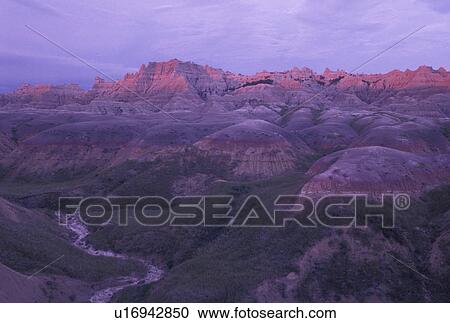 The Badlands, Badlands National Park, SD, South Dakota, Spectacular landscape of rock formations in Badlands Nat'l Park at sunset in South Dakota. View Large Photo Image Stock Image - The Badlands, Badlands National Park, SD, South Dakota, Spectacular landscape of rock formations in Badlands Nat'l Park at sunset in South Dakota.. Fotosearch