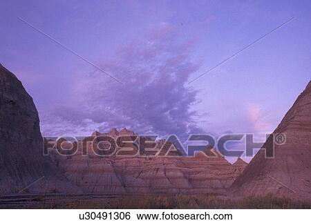 The Badlands, Badlands National Park, SD, South Dakota, Spectacular landscape of rock formations in Badlands Nat'l Park at sunset in South Dakota. View Large Photo Image Stock Photograph - The Badlands, Badlands National Park, SD, South Dakota, Spectacular landscape of rock formations in Badlands Nat'l Park at sunset in South Dakota.. Fotosearch