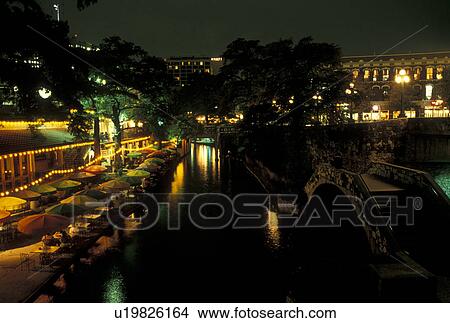 The Riverwalk, San Antonio, TX, Texas, Outdoor cafes and restaurants along Paseo Del Rio, The Riverwalk, in downtown San Antonio in the evening. View Large Photo Image Picture - The Riverwalk, San Antonio, TX, Texas, Outdoor cafes and restaurants along Paseo Del Rio, The Riverwalk, in downtown San Antonio in the evening. . Fotosearch