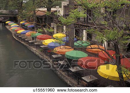 The Riverwalk, San Antonio, TX, Texas, An outdoor cafT with colorful umbrellas along Paseo Del Rio, The Riverwalk, in downtown San Antonio in the evening. View Large Photo Image Stock Image - The Riverwalk, San Antonio, TX, Texas, An outdoor cafT with colorful umbrellas along Paseo Del Rio, The Riverwalk, in downtown San Antonio in the evening. . Fotosearch