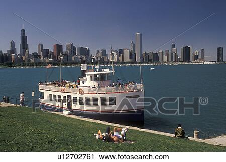 tour boat, Chicago Harbor, Chicago, IL, Lake Michigan, Illinois, Sightseeing tour boat loading passengers in Chicago Harbor. View of downtown skyline from the Lakeshore in Chicago. View Large Photo Image Stock Image - tour boat, Chicago Harbor, Chicago, IL, Lake Michigan, Illinois, Sightseeing tour boat loading passengers in Chicago Harbor. View of downtown skyline from the Lakeshore in Chicago.. Fotosearch