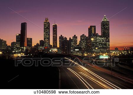traffic, road, skyline, Atlanta, GA, Georgia, Traffic lights streak on Freedom Parkway at sunset and view of the skyline of downtown Atlanta. View Large Photo Image Stock Photo - traffic, road, skyline, Atlanta, GA, Georgia, Traffic lights streak on Freedom Parkway at sunset and view of the skyline of downtown Atlanta.. Fotosearch