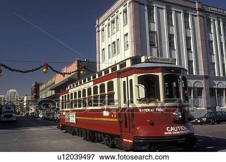 trolley, Galveston, TX, Texas, Gulf of Mexico, The red Galveston Island Trolley travels up the Strand in downtown Galveston. View Large Photo Image Stock Photo - trolley, Galveston, TX, Texas, Gulf of Mexico, The red Galveston Island Trolley travels up the Strand in downtown Galveston.. Fotosearch