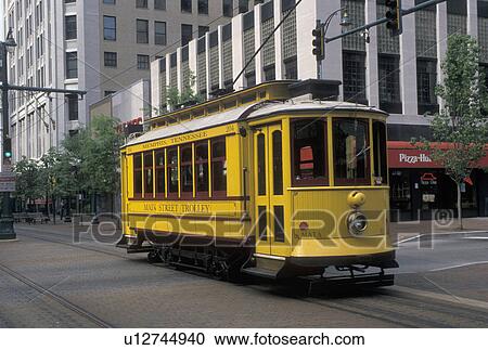 Stock Image -  trolley, Memphis, TN, Tennessee, Yellow Main Street Trolley coming down Main Street in downtown Memphis.. Fotosearch