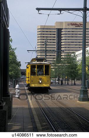 Stock Image -  trolley, Memphis, TN, Tennessee, Yellow Main Street Trolley coming down Main Street in downtown Memphis.. Fotosearch
