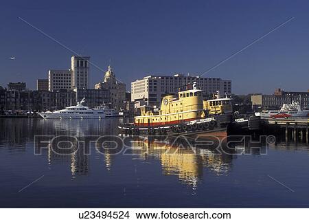 tugboat, Savannah, GA, Georgia, Tugboats on the Savannah River with view of downtown Savannah. View Large Photo Image Picture - tugboat, Savannah, GA, Georgia, Tugboats on the Savannah River with view of downtown Savannah.. Fotosearch