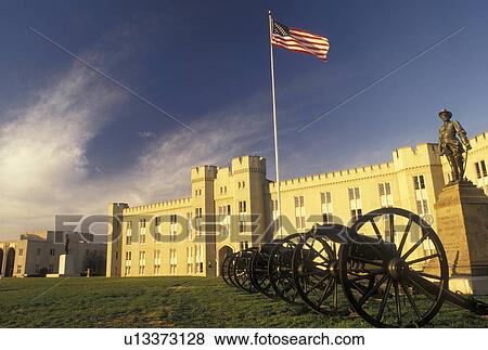 Stock Photo -  Virginia Military Institute, academy, Lexington, VA, Virginia, Cannons and the American Flag outside the Barracks on the campus of VMI in Lexington.. Fotosearch