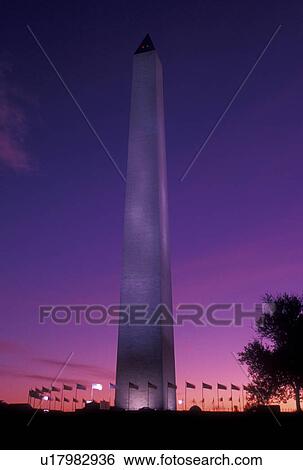 Stock Photograph -  Washington Monument, sunrise, DC, Washington, District of Columbia, The Washington Monument surrounded by American Flags at sunrise in Washington D. C.. Fotosearch