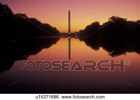 Stock Photograph -  Washington Monument, The National Mall, sunrise, Washington, DC, District of Columbia, The Washington Monument reflects in the reflecting Pool at sunrise at the National Mall in Washington D. C.. Fotosearch