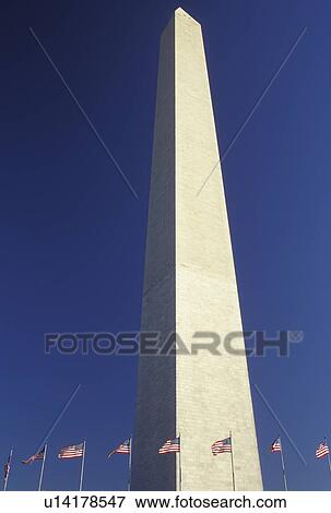 Washington Monument, Washington, DC, District of Columbia, The Washington Monument surrounded by American Flags stands erect against a clear blue sky in Washington D. C. View Large Photo Image Stock Photo - Washington Monument, Washington, DC, District of Columbia, The Washington Monument surrounded by American Flags stands erect against a clear blue sky in Washington D. C.. Fotosearch