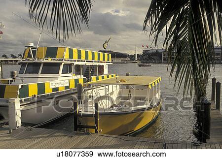 water taxi, Miami, FL, Florida, Atlantic Ocean, Yellow water taxi docked outside Bayside Marketplace, a shopping, dining, entertainment mecca, on Biscayne Bay in downtown Miami. View Large Photo Image Stock Photo - water taxi, Miami, FL, Florida, Atlantic Ocean, Yellow water taxi docked outside Bayside Marketplace, a shopping, dining, entertainment mecca, on Biscayne Bay in downtown Miami.. Fotosearch